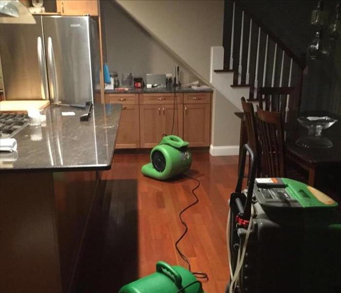 two air movers and a dehu in a kitchen